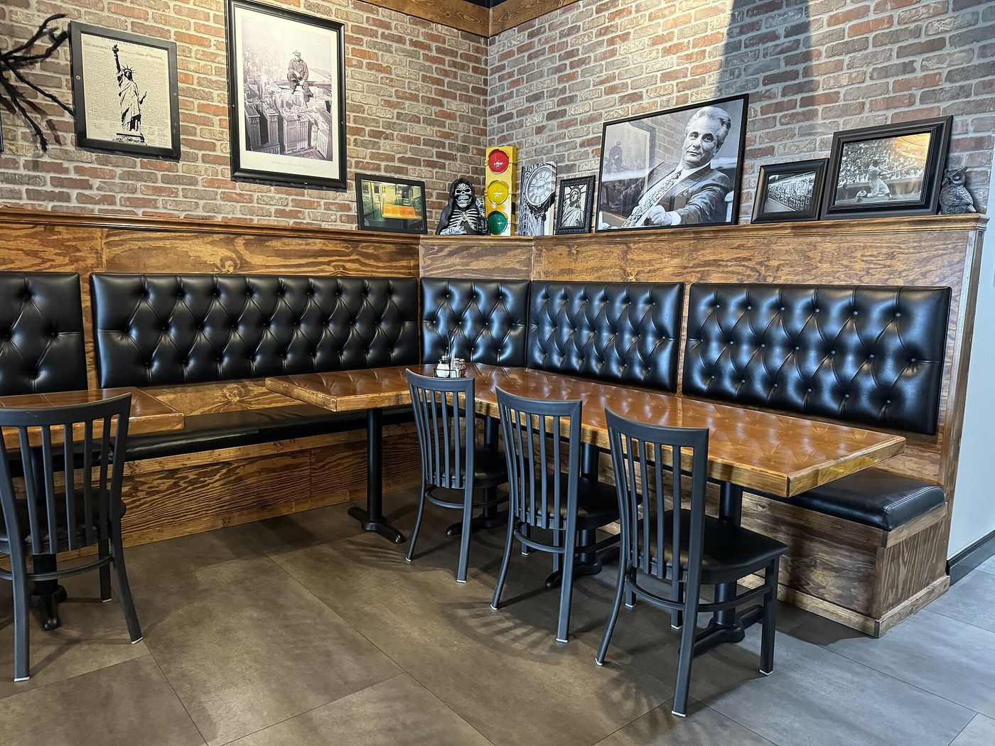 Leather booths and a brick wall in the dining room